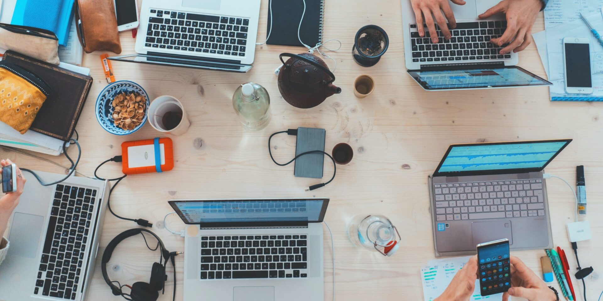 Laptops on desk of people onboarding